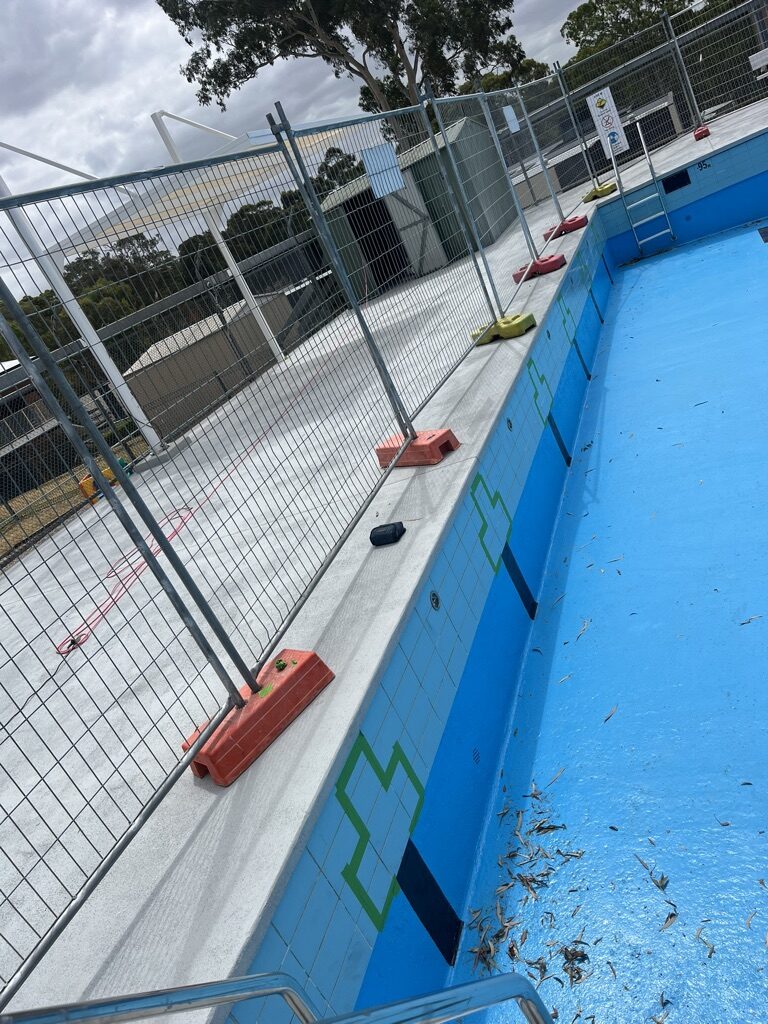 Public pool surface prepared before commercial resurfacing