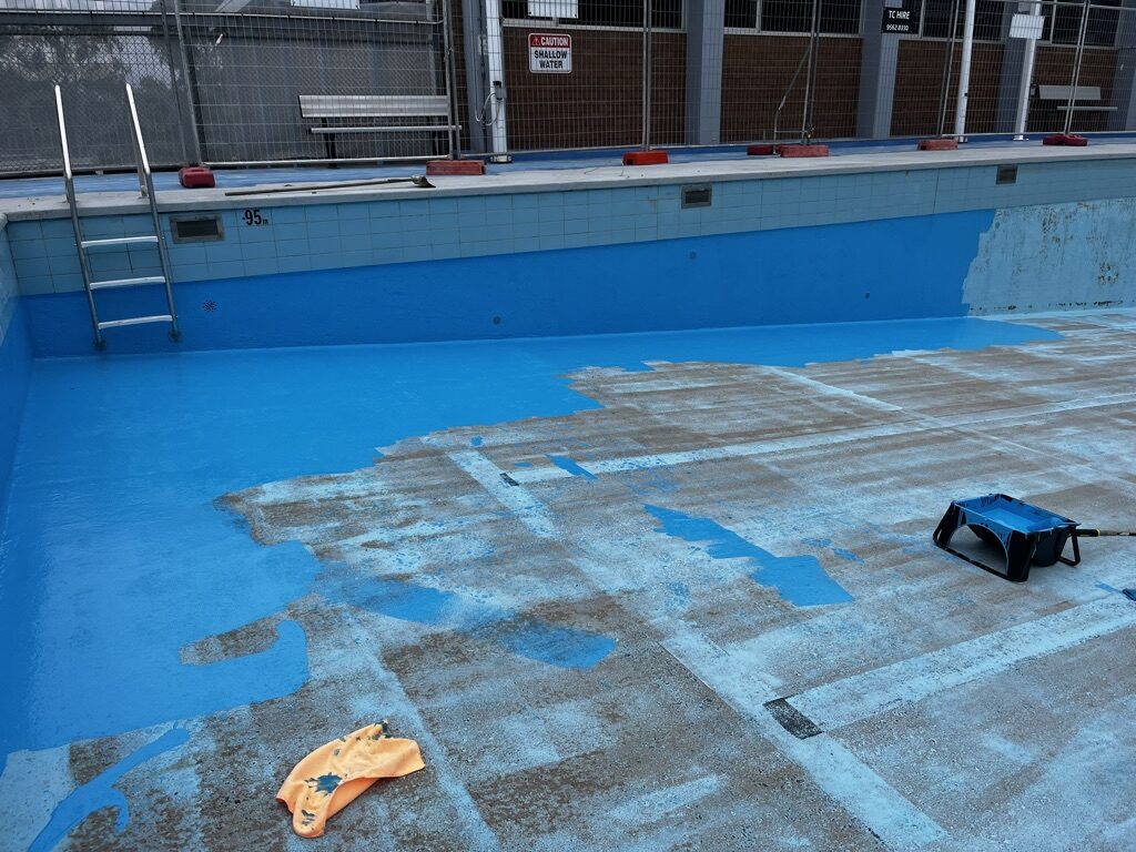 Commercial pool part-way through epoxy coating