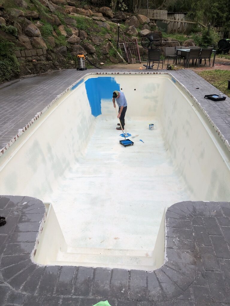 Applying epoxy coating to a drained residential pool